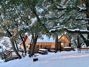 A cozy cabin with a wooden exterior, surrounded by snow-covered trees. - "Cozy Oaks Cabin" Peaceful Mountain Getaway, Charming & Romantic!  Trail Pass... (Idyllwild)