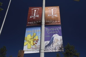 Four event banners on a pole.