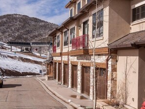 Situated on a street with a mountainous backdrop, this building offers a unique blend of urban and natural views.