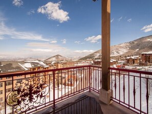 Enjoy breathtaking views of the surrounding mountains from this balcony.