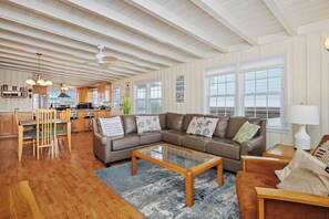 TV, books, stereo - Smart Pelican: Dog-Friendly Oceanfront Cottage with Modern Kitchen (Oak Island)