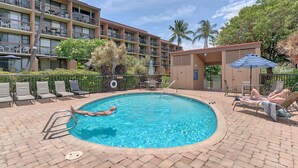 A swimming pool with lounge chairs and a building in the background. - Maui Vista #2-101 Ground Floor, Pickle Ball Courts, Near Kamaole Beach Park (Kihei)
