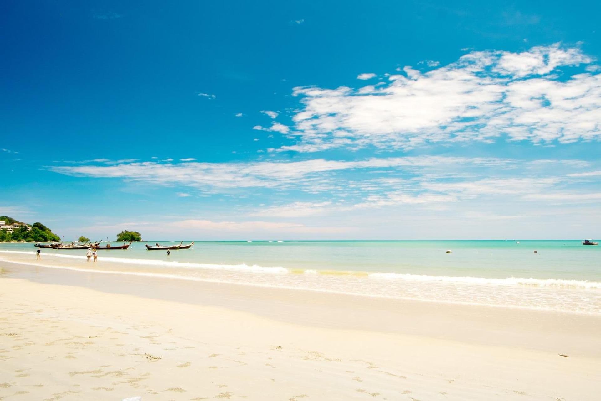 A beach with clear skies and calm waters.