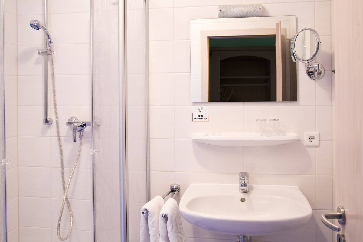 double room (forest view) | bathroom | shower, free toiletries, towels