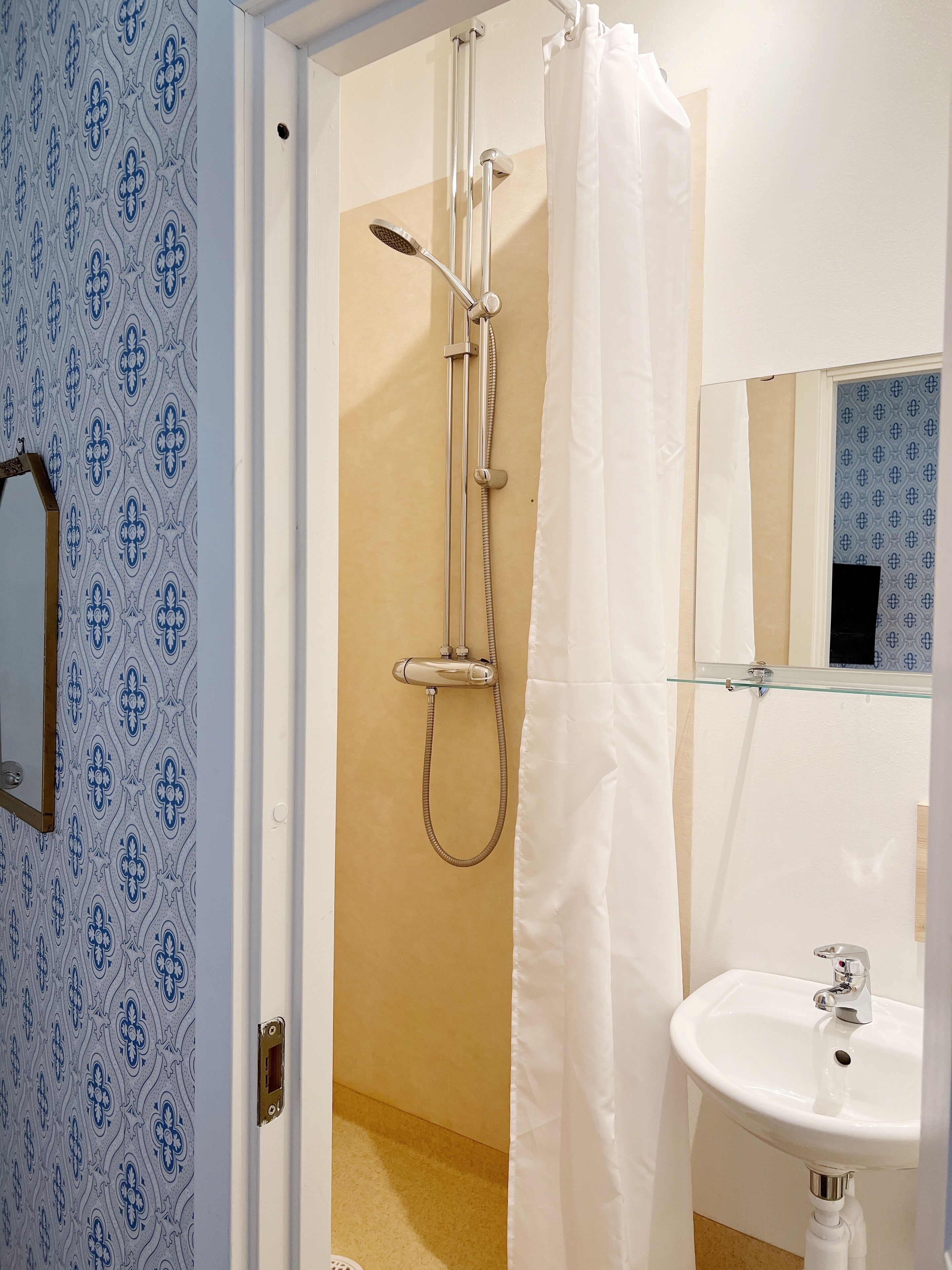 basic single room | bathroom | shower, eco-friendly toiletries, towels, soap