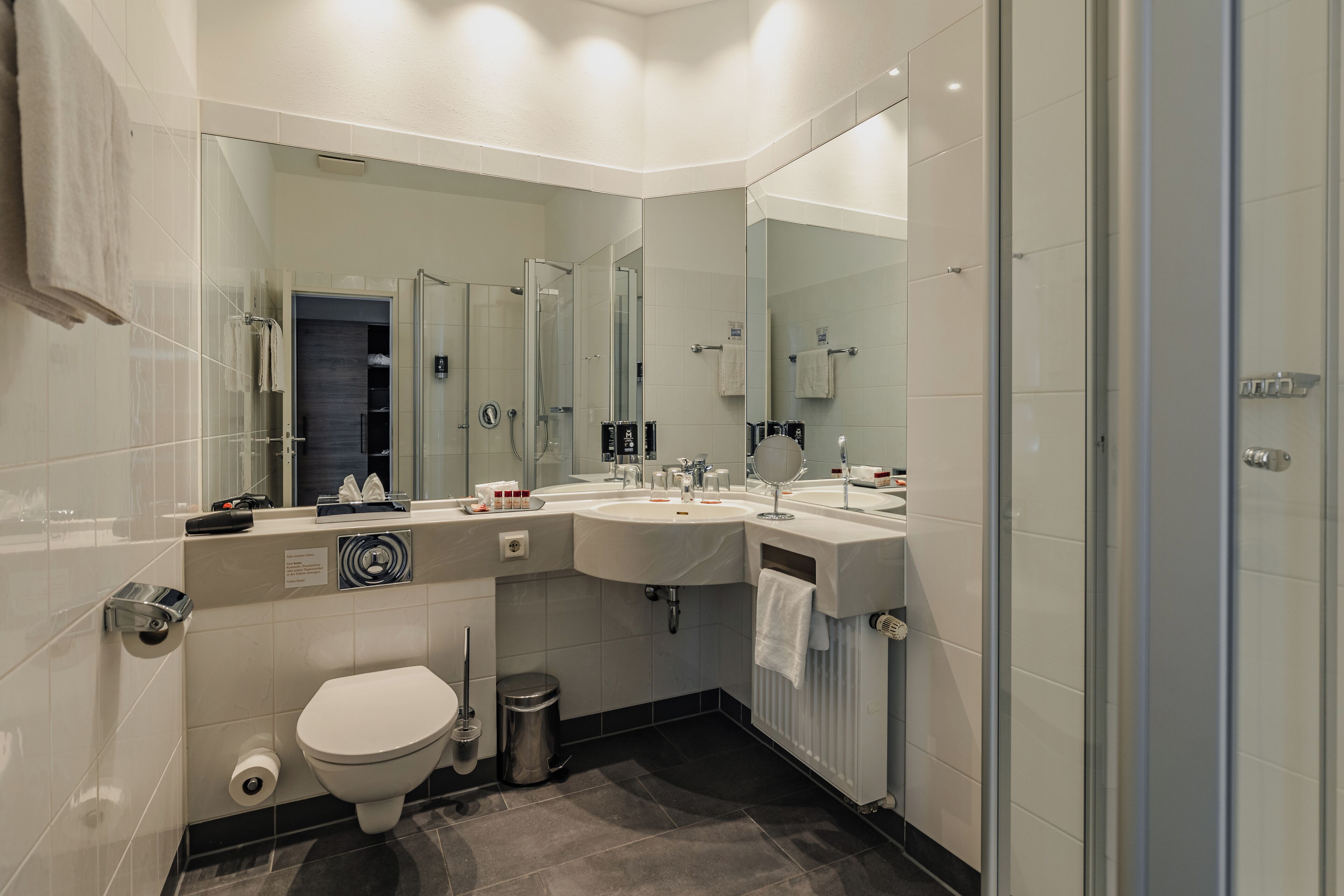 shower, free toiletries, slippers, towels