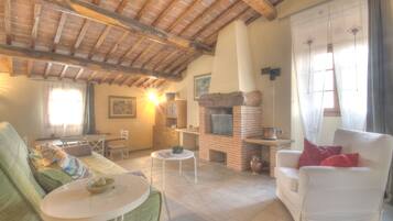 Apartment, 1 Bedroom (Tramontana) | Living area | Flat-screen TV