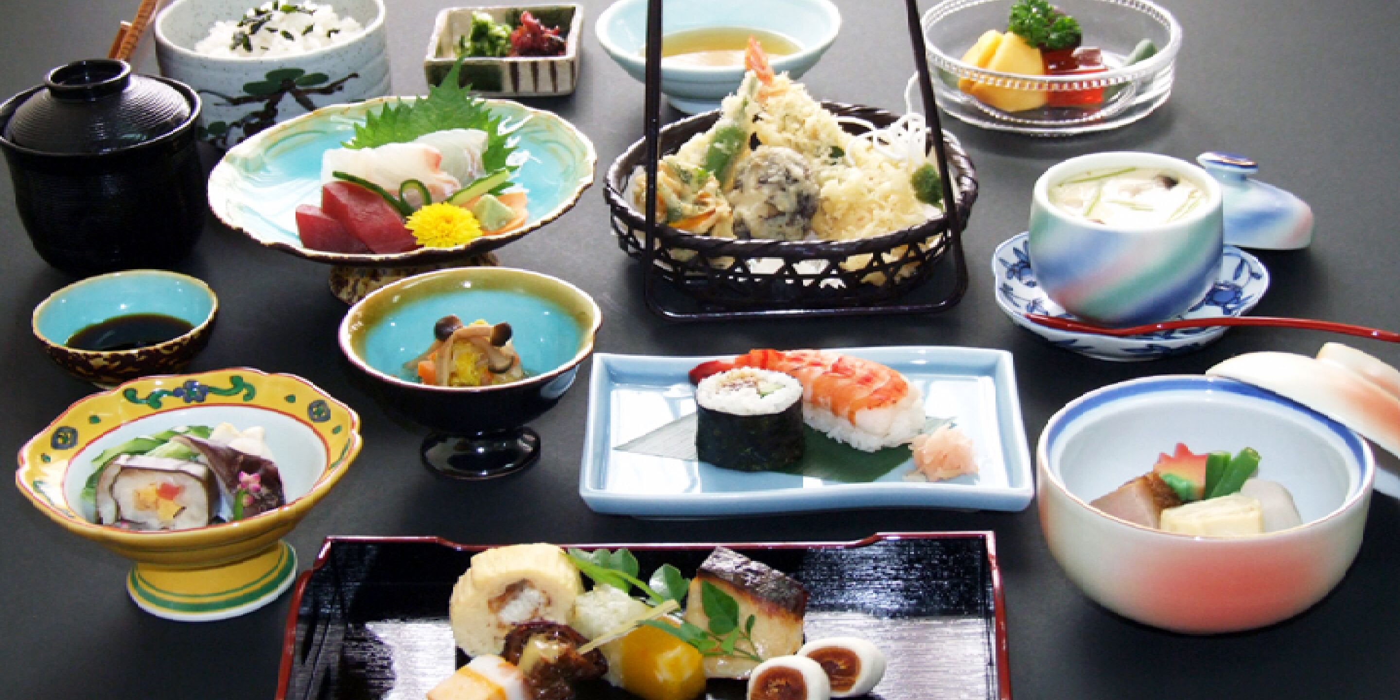 A variety of Japanese dishes arranged on a table.