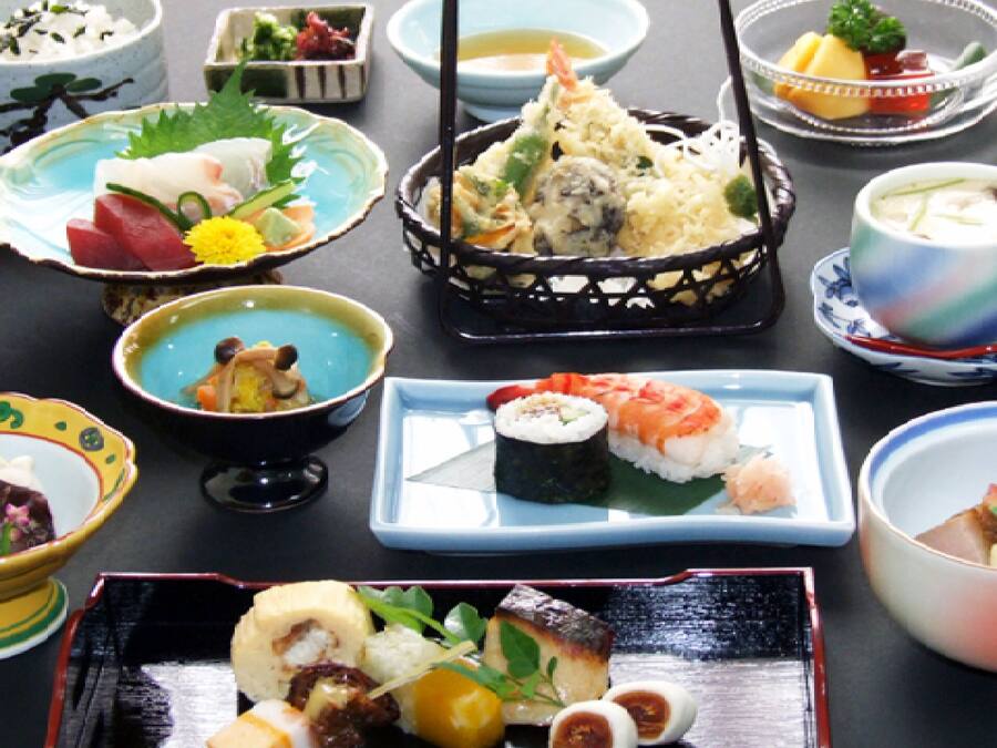 A variety of Japanese dishes arranged on a table.