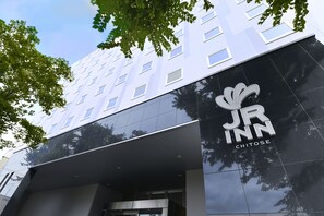 A modern building with a prominent 'JR Inn Chitose' sign on the facade. - JR Inn Chitose (Chitose)