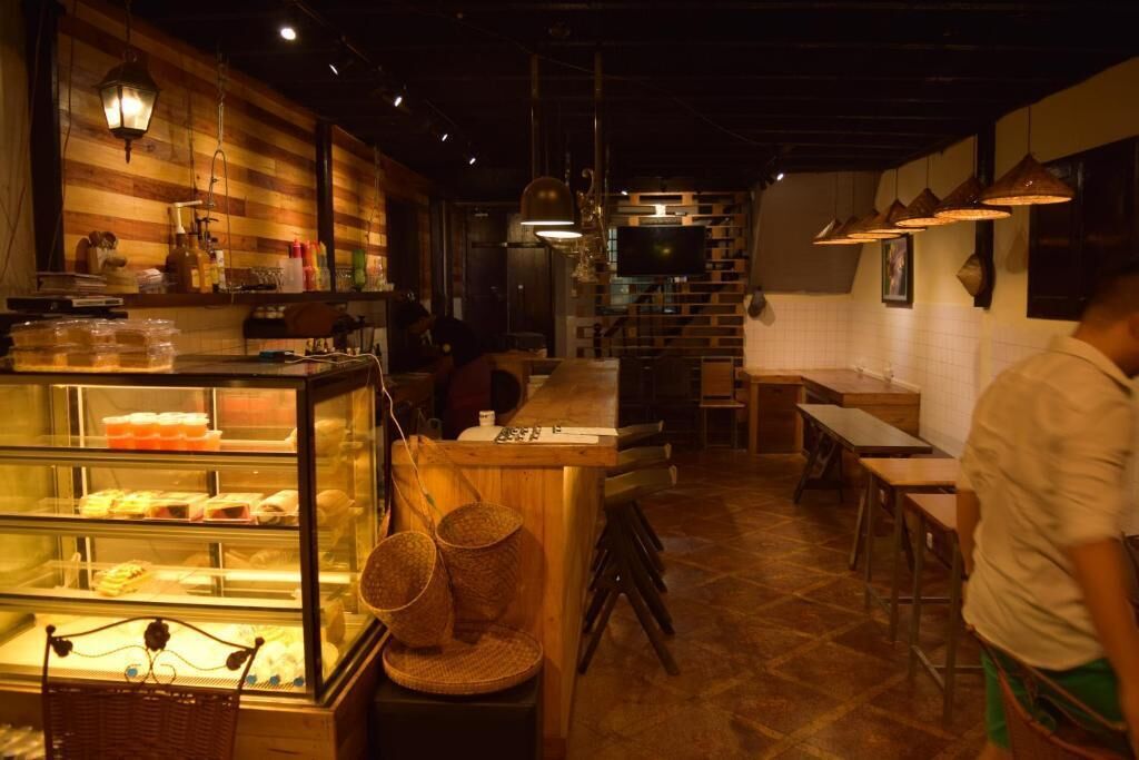 A restaurant interior with a counter, display cases, and a seating area.