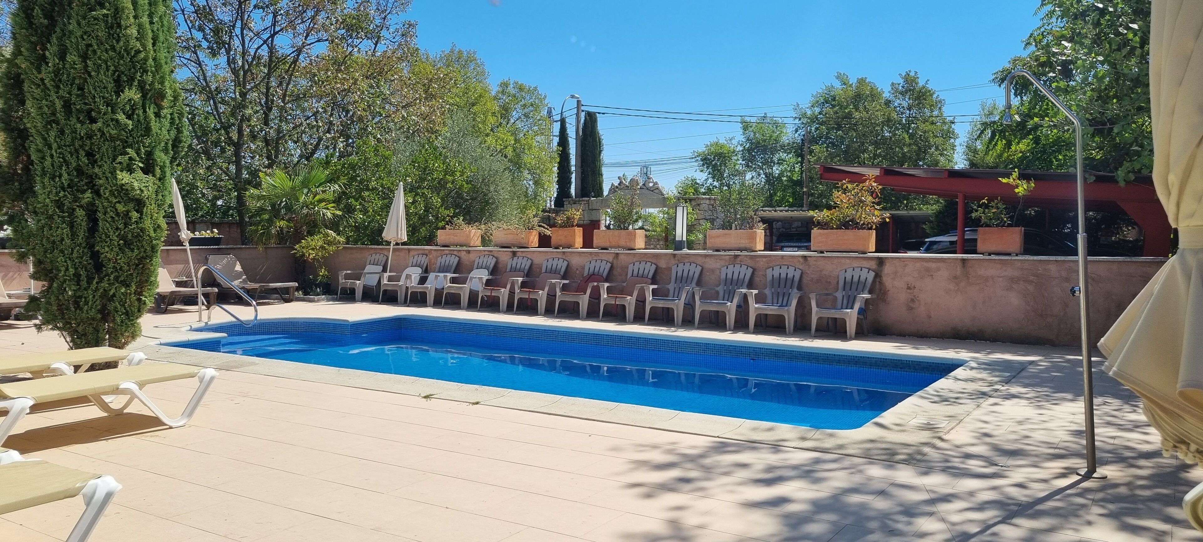 Outdoor pool, open 11:00 AM to 9:00 PM, pool loungers