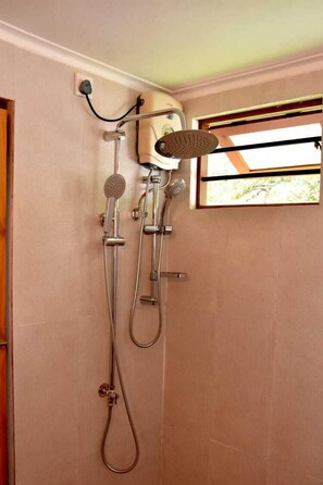 Shower, rainfall showerhead, bidet, towels