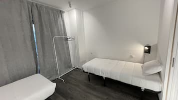 Twin Room, Private Bathroom | Blackout curtains, bed sheets, wheelchair access