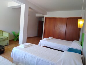 Family Quadruple Room | Blackout drapes, free WiFi, bed sheets