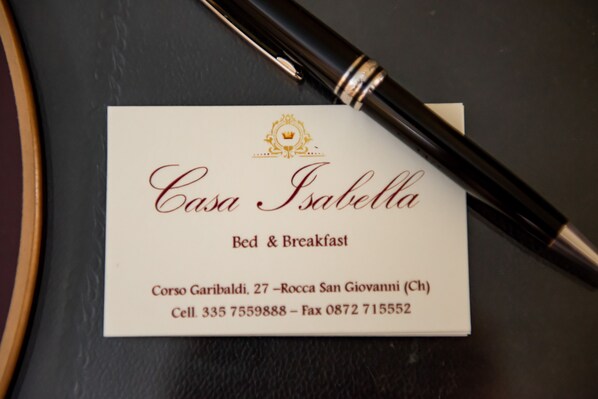 A business card for Casa Isabella, offering bed and breakfast services. The card includes the name, services, address, and contact information. - Casa Isabella (Rocca San Giovanni)