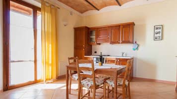 Apartamento, 1 quarto (Le Volticine) | Cozinha privada | Geladeira grande, fogão, cooktop, lava-louças