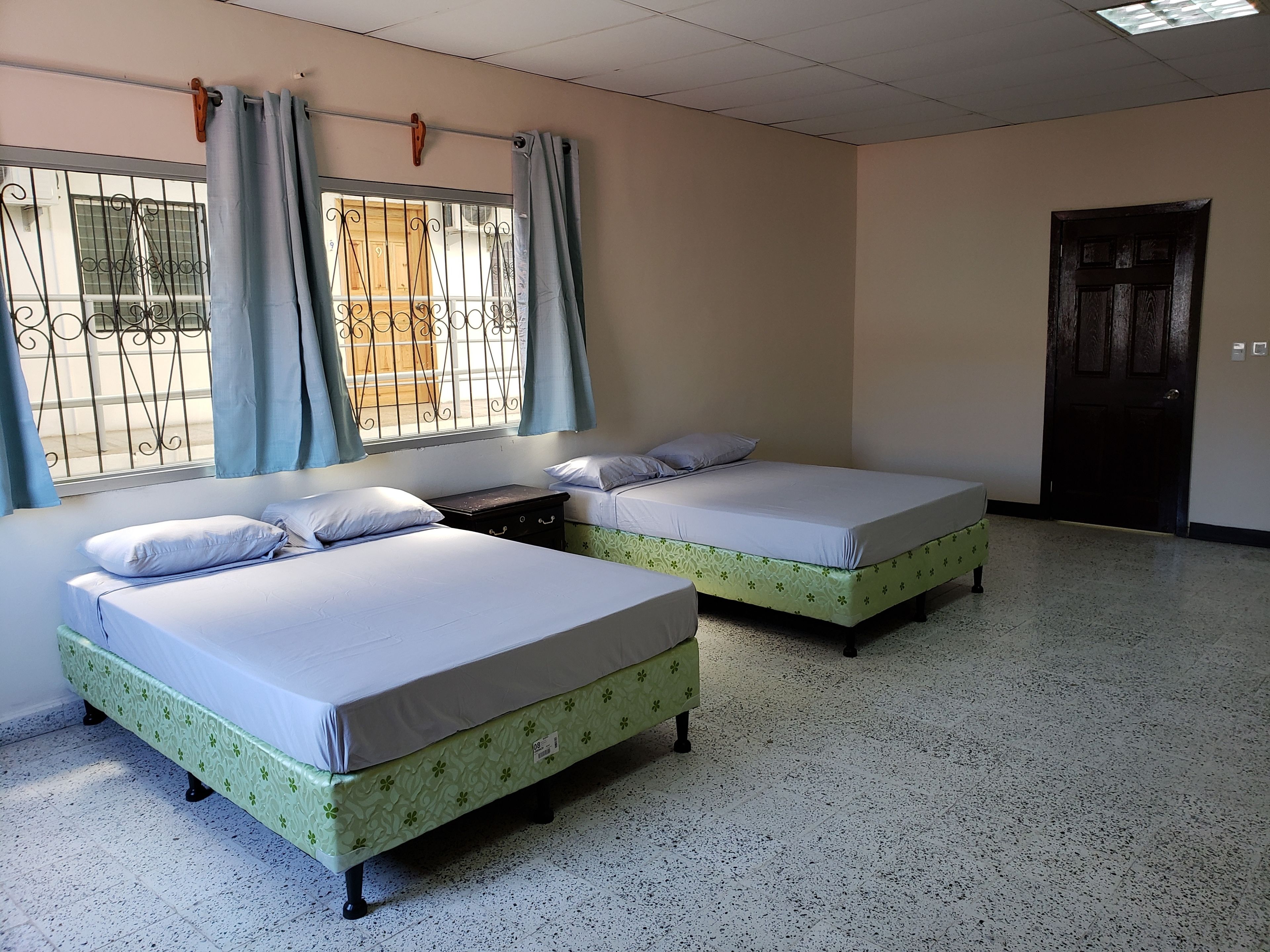 basic double room, 2 queen beds, ensuite, courtyard area | air conditioning