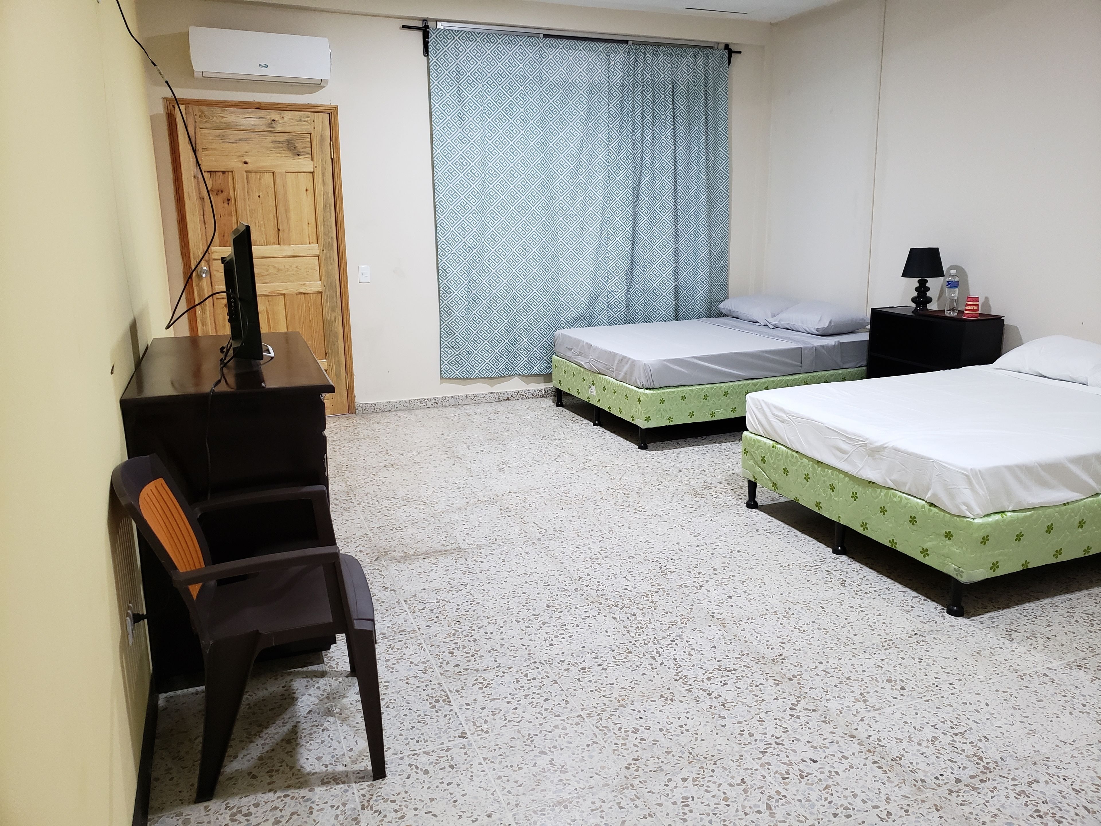 basic double room, 2 queen beds, ensuite, courtyard area | living area | 32-inch led tv with cable channels, tv