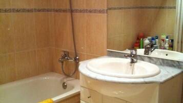 Combined shower/tub, hair dryer, towels, toilet paper