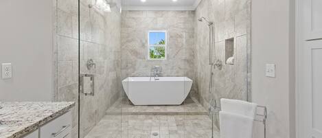 Combined shower/tub, towels, shampoo, toilet paper