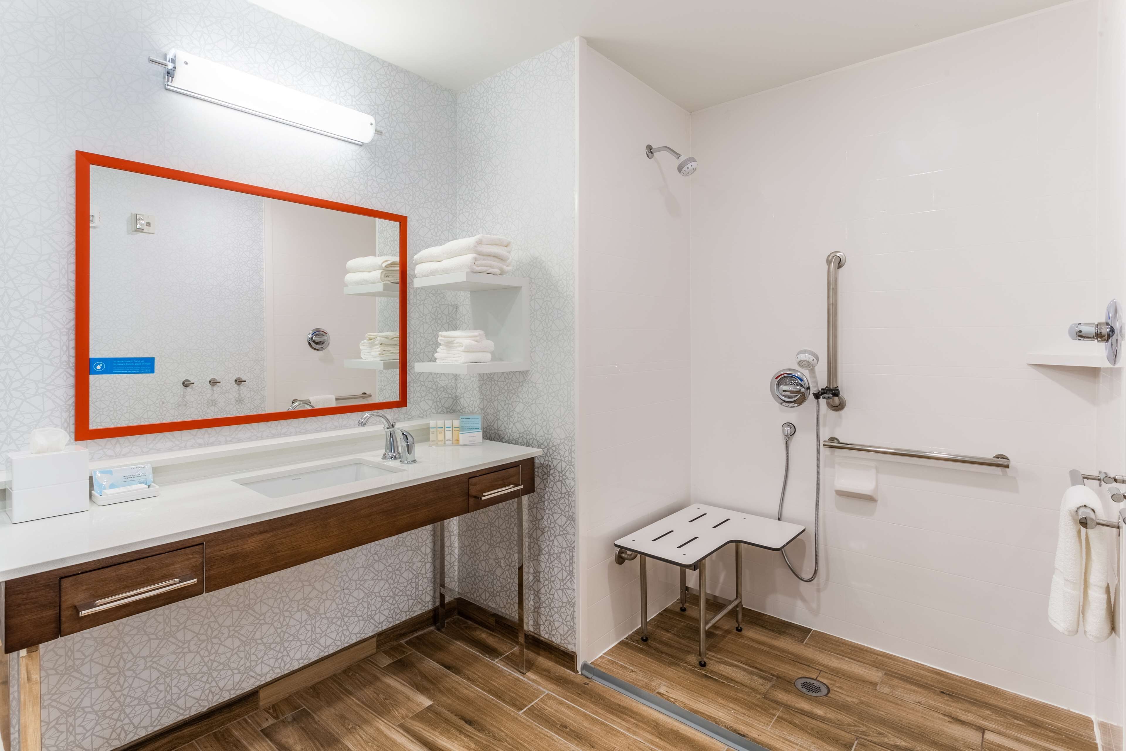 room, 1 king bed, accessible (roll-in shower, mobility & hearing) | bathroom | separate bathtub and shower, towels
