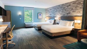 A hotel room with two beds, a desk, a chair, a TV, and a window with a view of greenery. - Home2 Suites by Hilton Dayton/Centerville (Dayton)