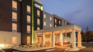 A hotel with a modern facade, a covered entrance, and a sign indicating 'Home Suites by Hilton'. - Home2 Suites by Hilton Dayton/Centerville (Dayton)