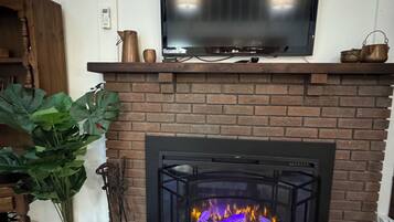 42-inch TV with cable channels, fireplace, DVD player