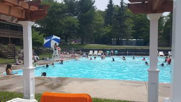 Seasonal outdoor pool, open 11:30 AM to 6:30 PM, lifeguards on site