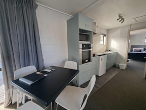 Family Apartment | Private kitchen | Mini-fridge, microwave, coffee/tea maker, electric kettle