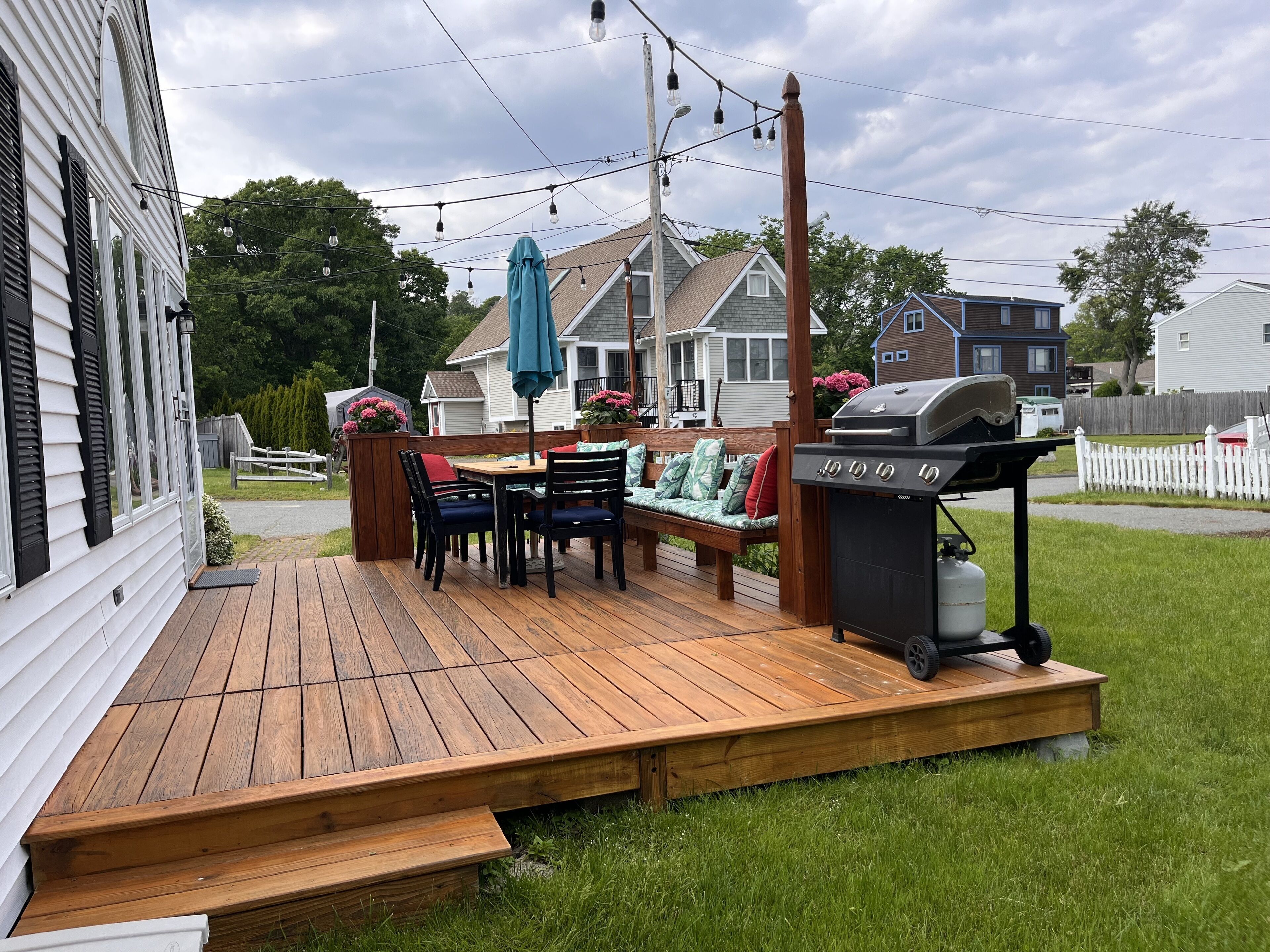Deck with grill, dining for 6+ and outside lights