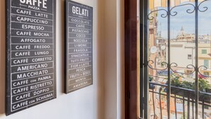 Two black signs listing various coffee and gelato options. - Lago Terrione Apartment - Charme Holidays (Rome)