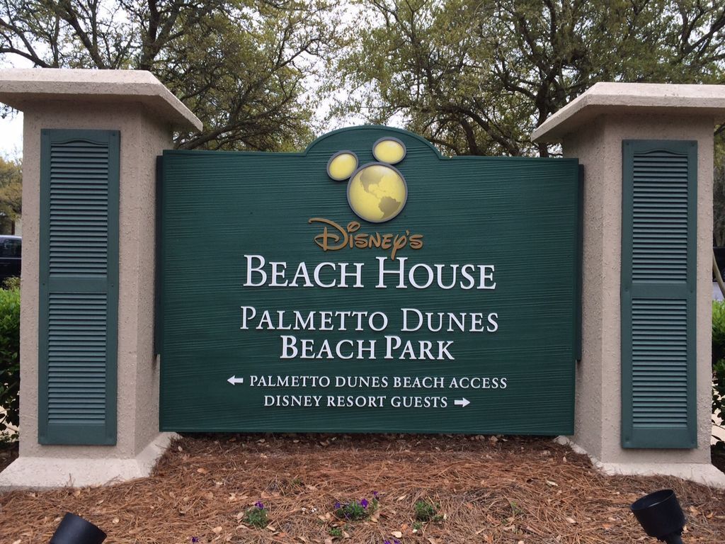 A sign for Disney's Beach House at Palmetto Dunes Beach Park, indicating beach access for Disney resort guests.