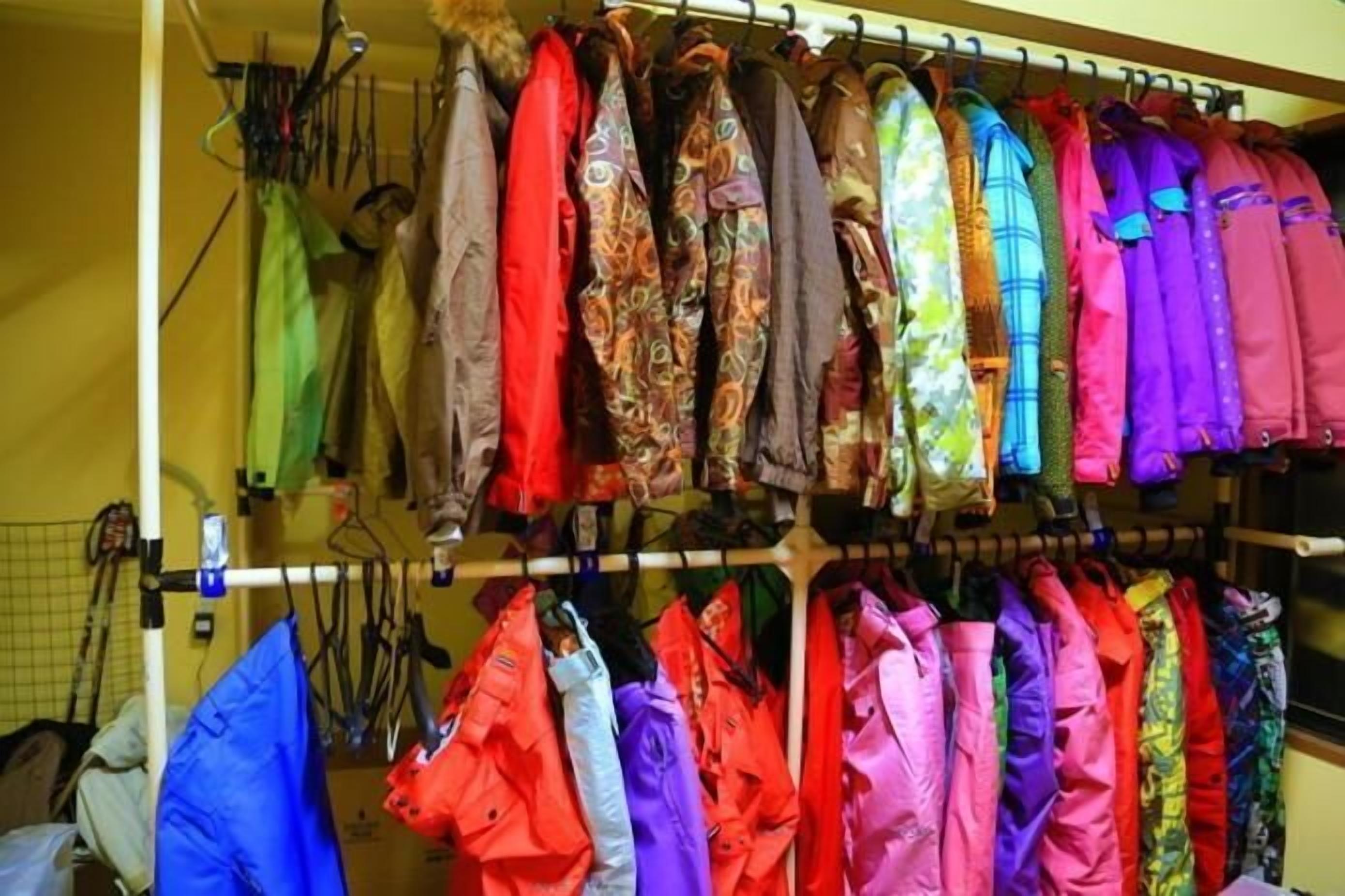 A rack of colorful jackets hanging in a store.