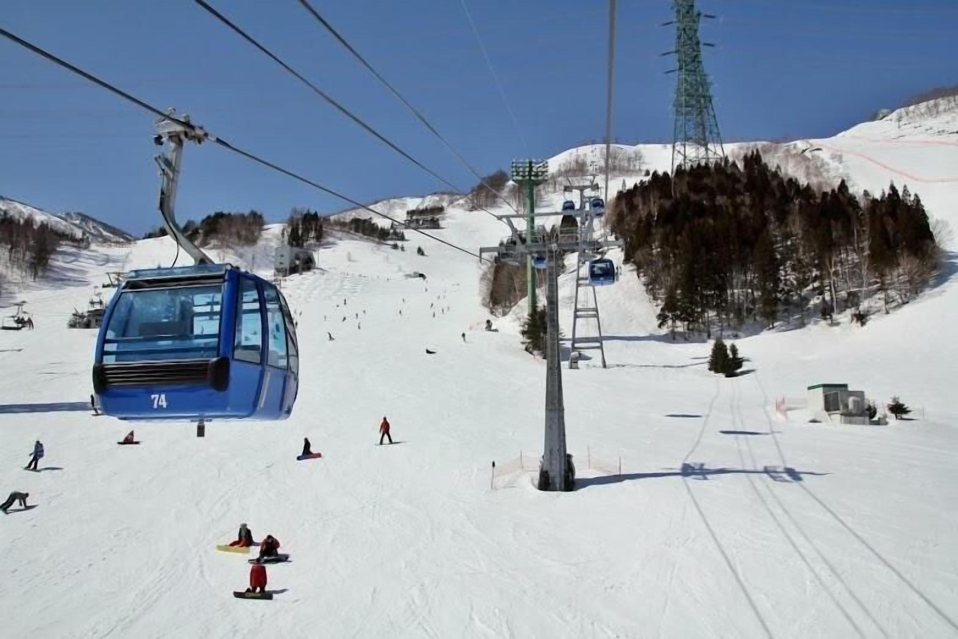 A ski lift with a cable car moving along the track.