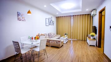Apartment, 2 Bedrooms | Living area | 40-inch flat-screen TV with cable channels, Smart TV