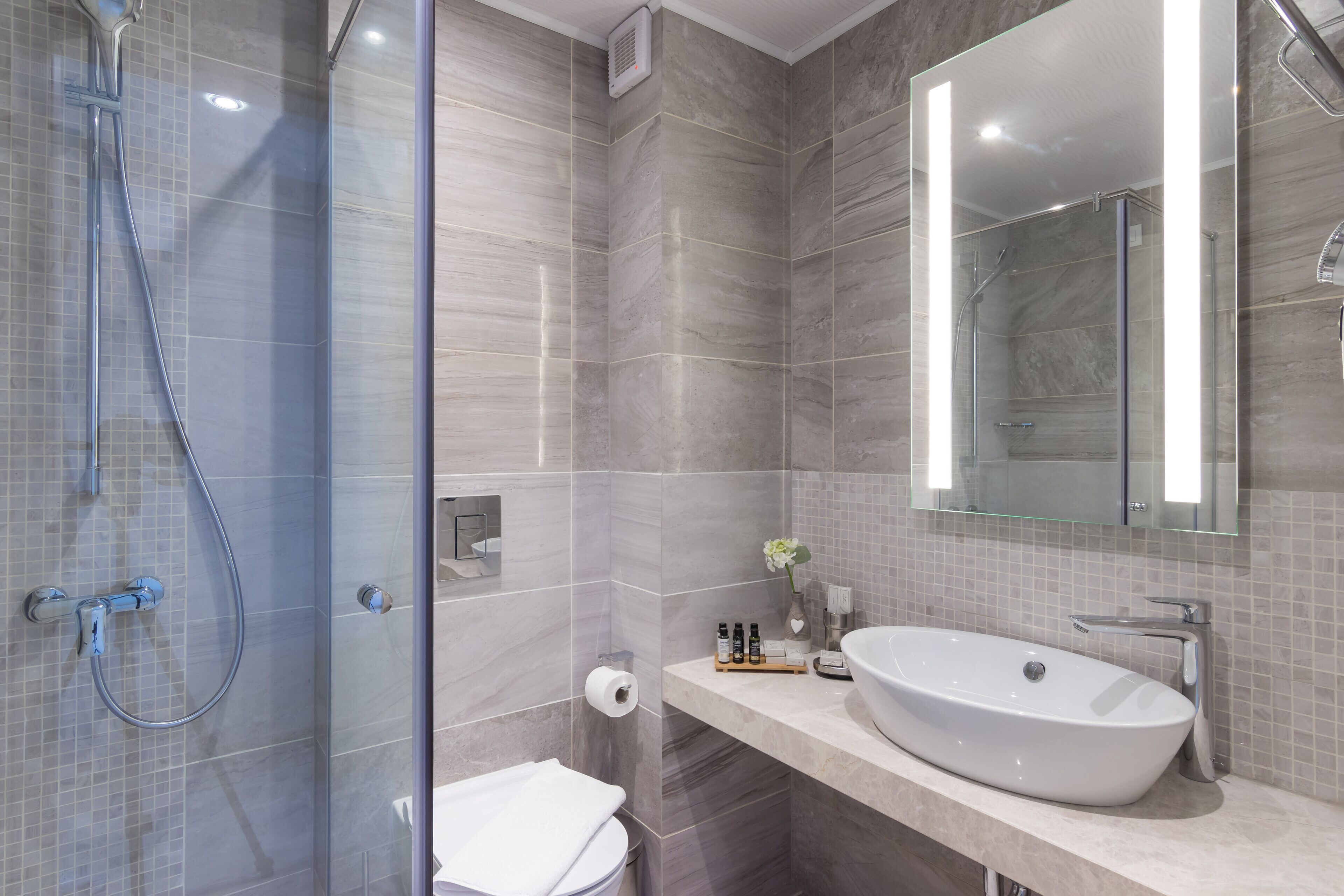 deep-soaking bathtub, rainfall showerhead, eco-friendly toiletries