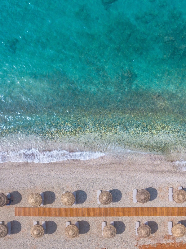 On the beach, sun-loungers, beach umbrellas, beach towels