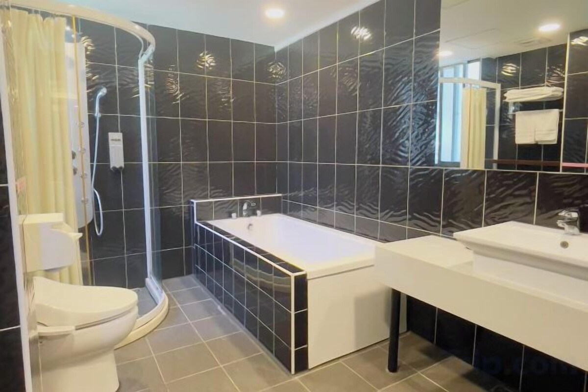 Bathroom | Hair dryer, slippers, bidet, toilet paper