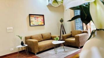 Superior Apartment, 1 Bedroom | Living area | Flat-screen TV, table tennis