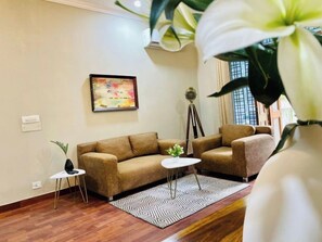 Superior Apartment, 1 Bedroom | Living area | Flat-screen TV, ping pong