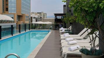 Outdoor pool, pool umbrellas, sun loungers