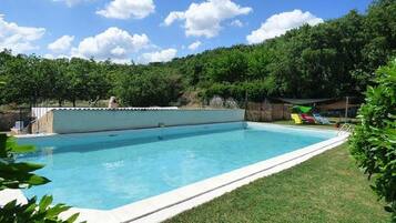 Seasonal outdoor pool, pool loungers