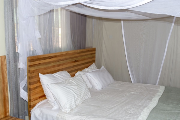 Suite, 1 Bedroom, Garden View | In-room safe, desk, laptop workspace, iron/ironing board