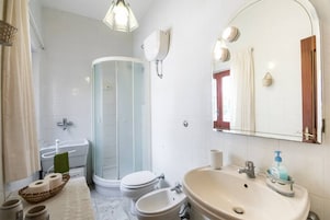 Comfort Apartment, Patio, Garden Area | Bathroom | Shower, hair dryer, bidet, towels