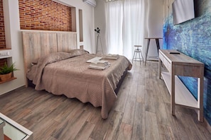 Habitació doble Deluxe | Llençols de cotó egipci, roba de llit d'alta qualitat i cobrellits 