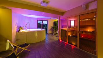 Relax in a serene space with a curved tub, wooden storage, and a cozy seating area.