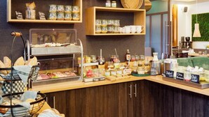 A breakfast bar with various food items and condiments. - Goldener Engel Hotel - Restaurant (Heppenheim)
