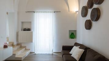 Appartamento, 1 camera da letto | Area soggiorno | TV a schermo piatto